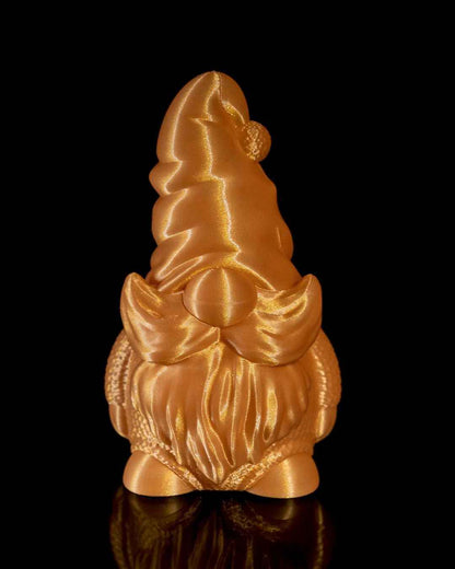 Front view of a gnome statue featuring curly flared side whiskers and a pom-pom hat, finished in reflective bright gold.