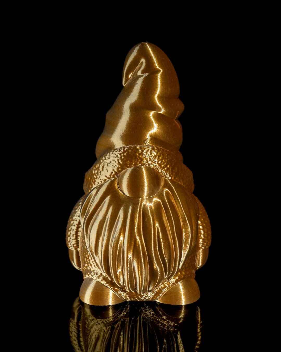 Close front view of a gnome statue with a large, heavily grooved beard, finished entirely in deep metallic bronze.
