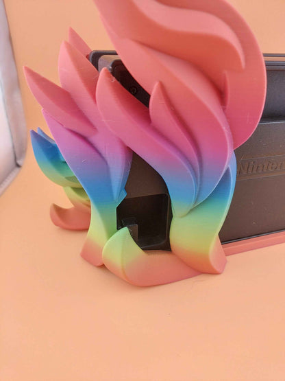 Close up view of the top sections of the curved, matte flames, showing a pink-to-blue colour transition.