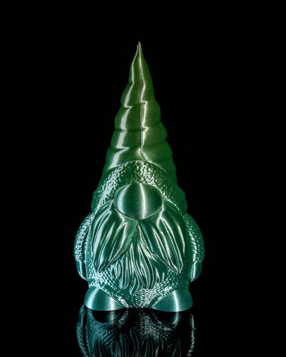 Full front view of a colour-shifting gnome statue with a pointed cap, finished in bright emerald green.