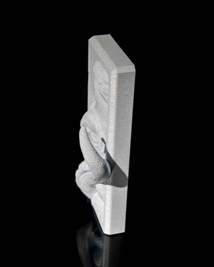 Extreme side profile view of the thick, rectangular panel featuring a solid, brushed silver texture.