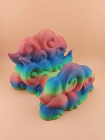 Low, straight view of the empty coiled cloud holder. Smooth plastic features intense rainbow gradient colour banding.