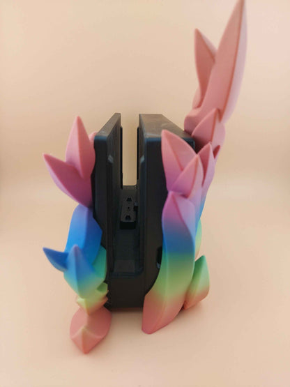 Side view of the console dock opening, flanked by geometrically stylised rainbow Flame that curve outwards.