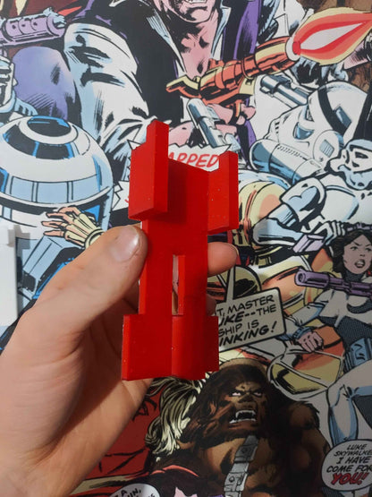 Side view of the solid matte red T-shaped mounting bracket, designed to fit into the car's chassis.