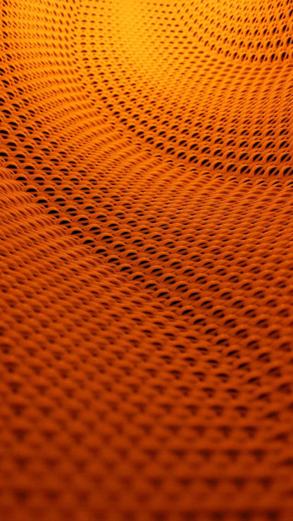 Extreme close-up, high-saturation orange view of the lampshade's intricate, wavy, porous basket-weave mesh pattern.