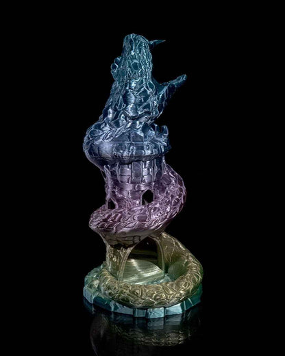 Front view of the shimmering tower dice roller, showing the open, fanged dragon mouth at the apex.