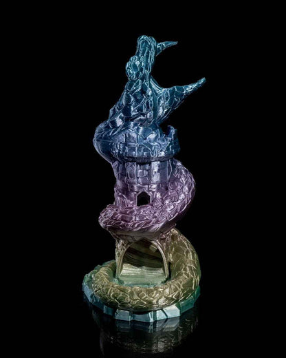 Straight-on product shot of the majestic dragon head tower, transitioning from shimmering teal to purple to gold.