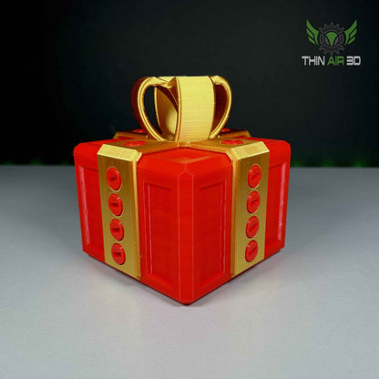 Bright red gift box puzzle with shiny gold ribbon and bands. Close up details of the red circular fasteners.