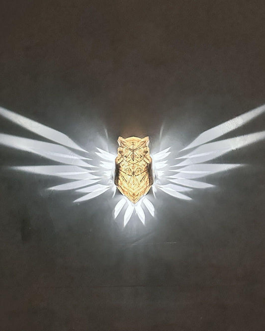 Owl night light glowing softly in a dark room, creating a cozy ambiance