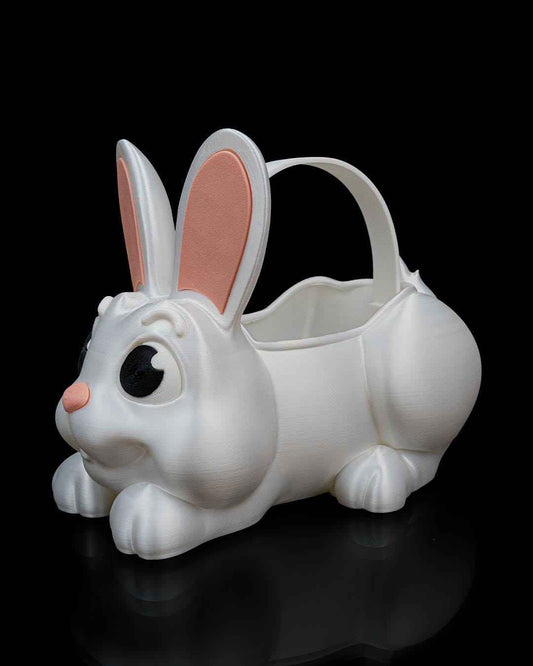 Shimmering white bunny basket in a resting pose, viewed from the side. Features pink inner ears and nose.