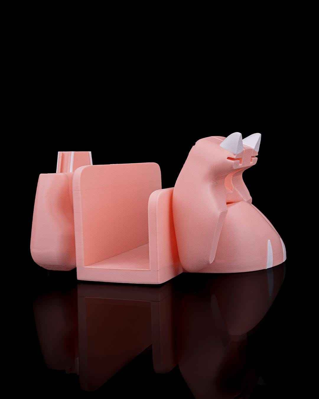 Side view of the empty matte peach dock storage structure. White ears and a slight white tail detail are visible.