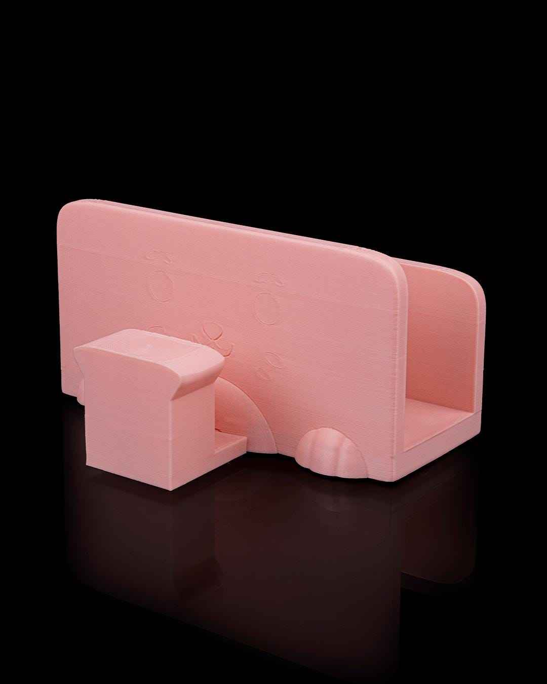 Low-angle three-quarter rear view of the empty matte peach storage dock base. Smooth, minimalist design.