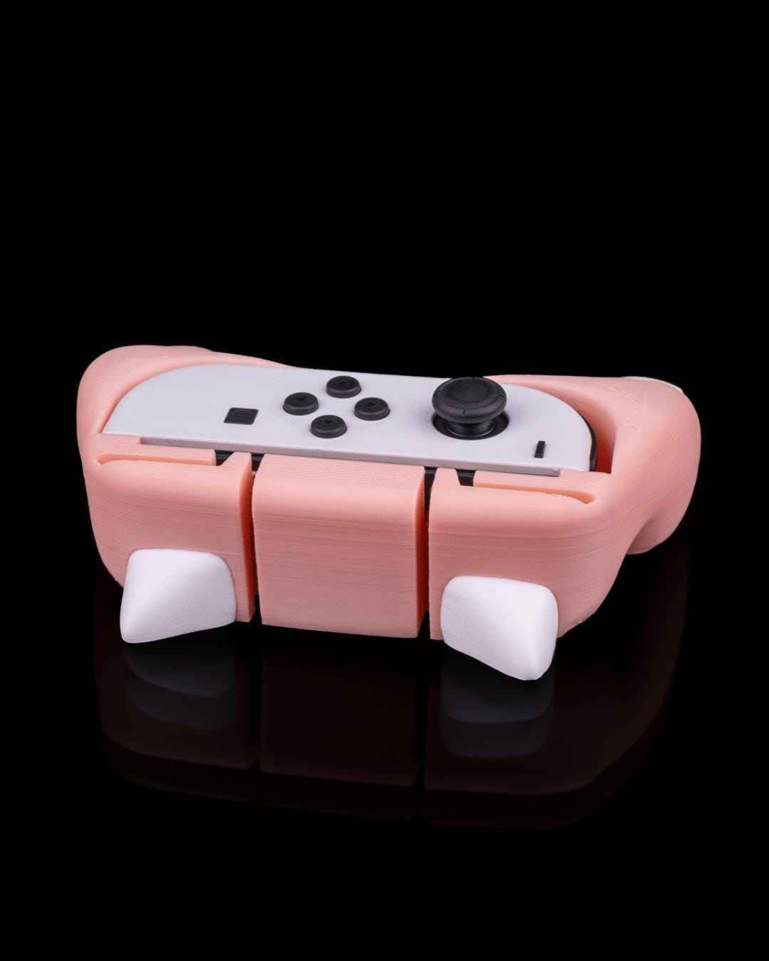 Low, side view showing the bottom segmentation of the pink grip and the small white resting feet details.