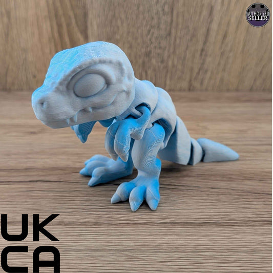 Two-tone icy blue, articulated dinosaur fidget toy shown in a side profile view.
