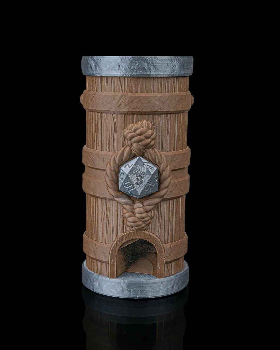 Front view of the medium brown barrel dice tower. Grey filament hoops and an attached rope knot centerpiece securing a silver D20.