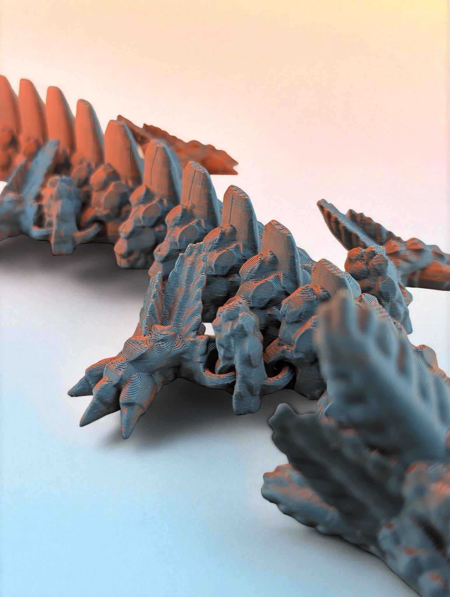 Shallow depth of field shot highlighting the blue body texture and the vibrant orange dorsal fins rising sharply.