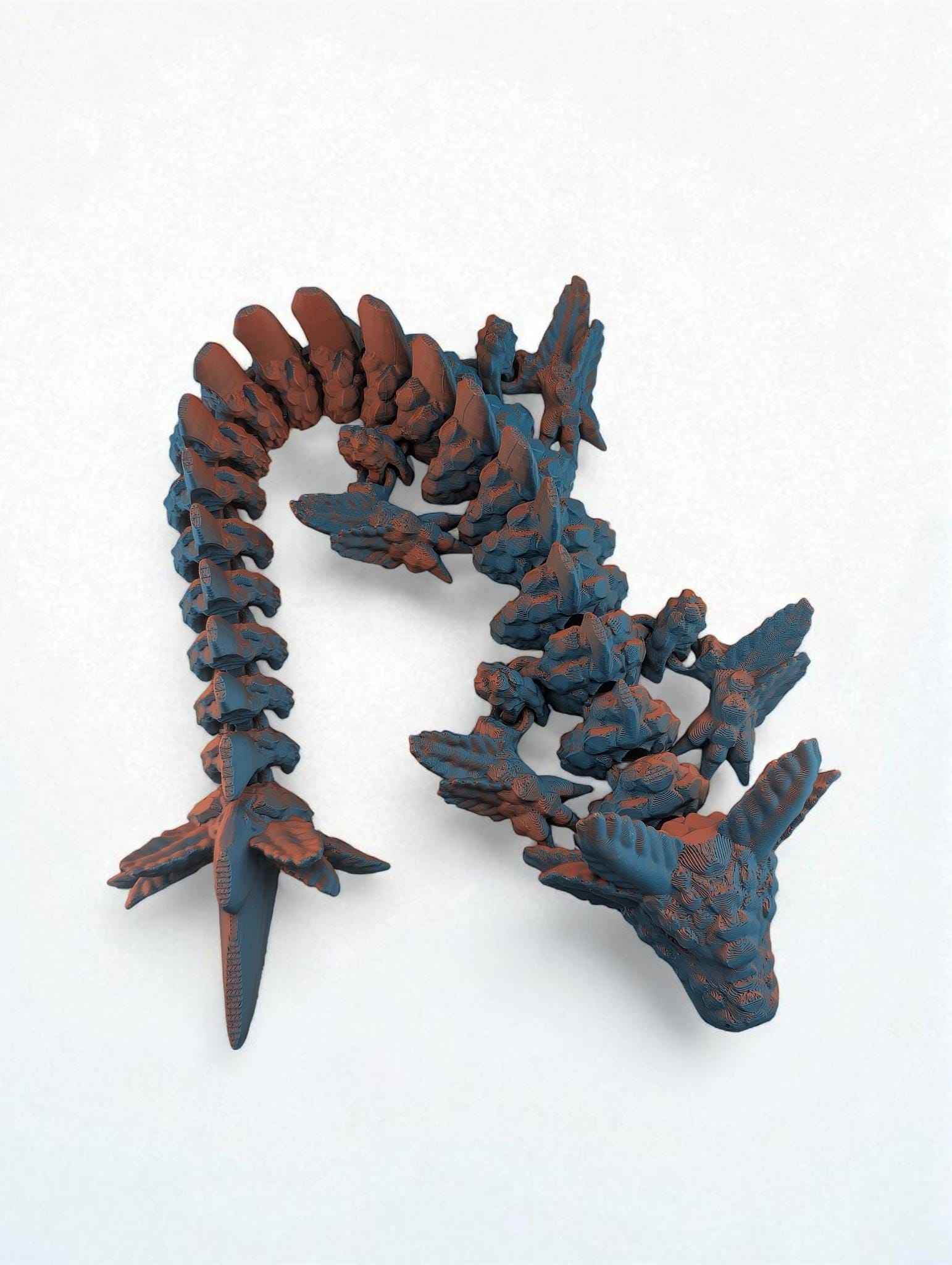 Overhead shot of the articulated dragon in a vertical curve, displaying the rough blue texture and orange coloration.