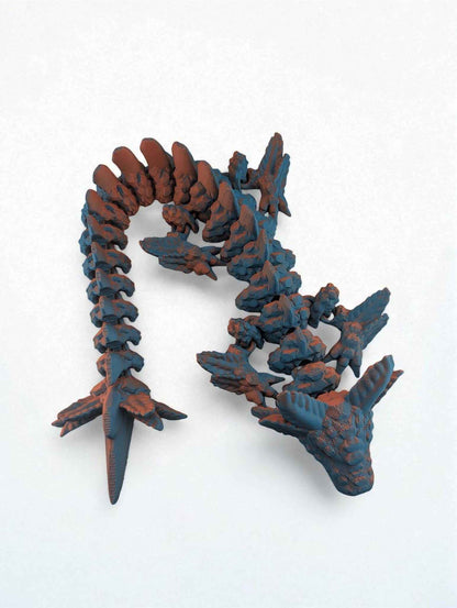 Overhead shot of the articulated dragon in a vertical curve, displaying the rough blue texture and orange colouration.