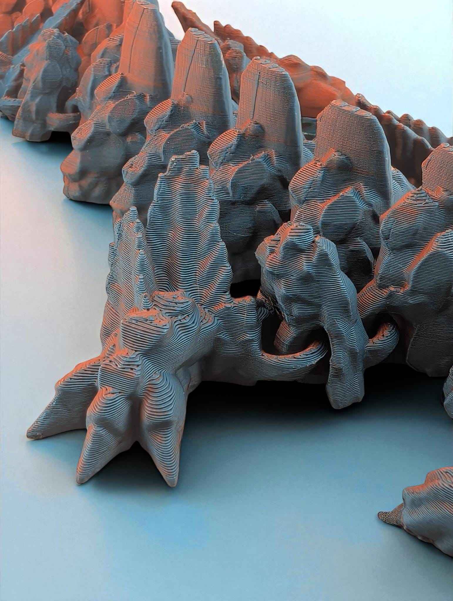 Dramatic low-angle close up emphasizing the jagged blue texture and fiery orange highlights on the articulated segments.