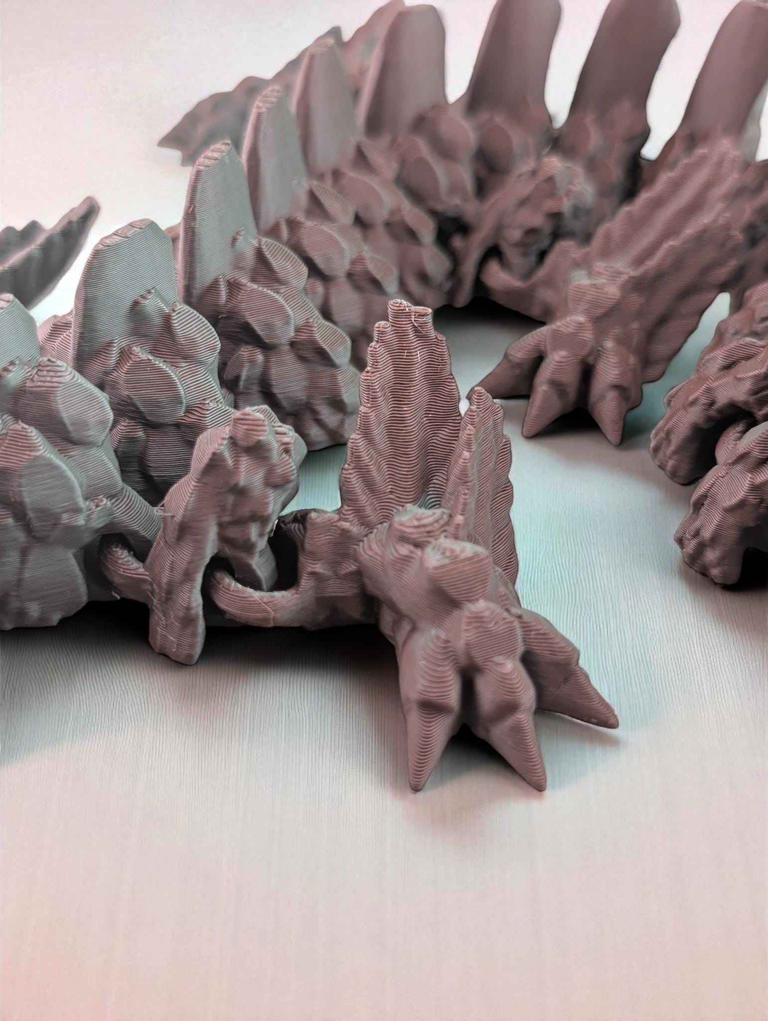 Low angle, close up of the matte articulated body, emphasizing the rough, jagged, stalactite-like texture.