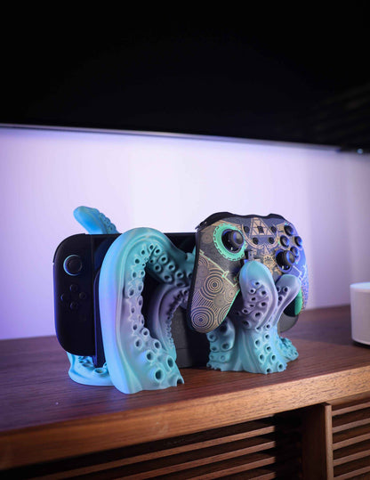Matte blue/purple kraken stand holds a console and a patterned, artistic gaming Pro Controller.