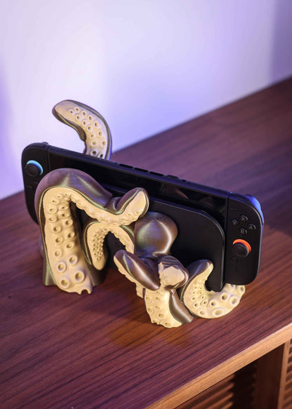 Side profile of the olive and brown kraken stand firmly holding a horizontal black console.